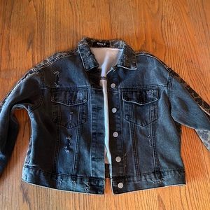 Woman’s black denim jacket with cheetah on the back